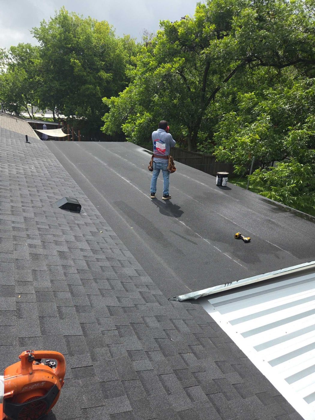 Three different roof systems on one Austin home including a standing seam metal section