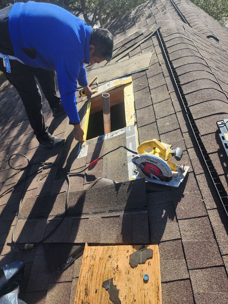 AAR crew member installing pipe boot and decking repair on the PJ Vasquez insurance claim project · 9424 El Rey Blvd